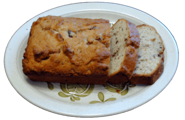 my banana bread shown on a platter with two pieces sliced ready to take