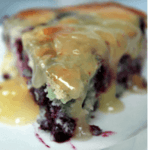 Blueberry buckle drizzled with lemon sauce used as a header image