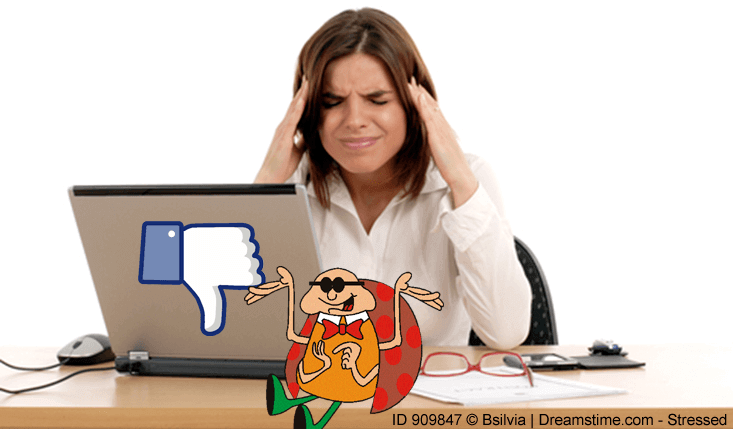 a very frustrated lady sitting in front of a laptop computer with a bug sitting in front