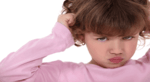 close up of a little girl pouting and pulling her hair
