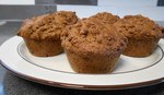 side view of bran muffins on a plate